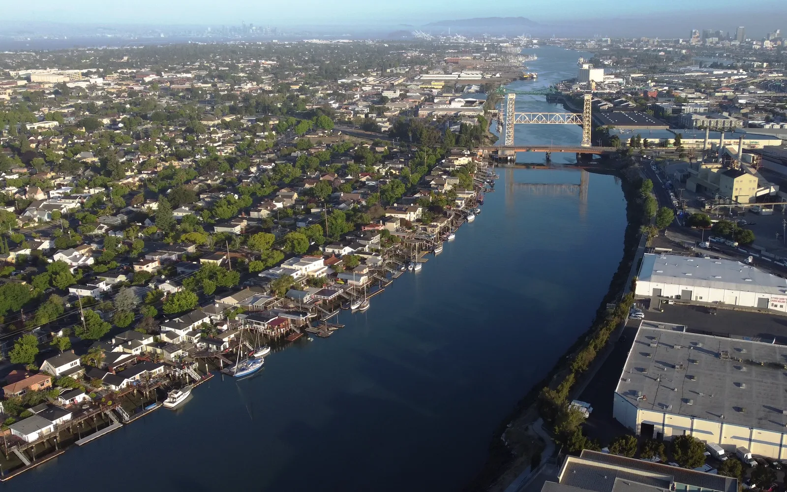 Aerial view of the Oakland Estuary with Fruitvale Bridge and Park Street Bridge connecting Alameda and Oakland